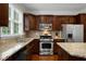 Updated kitchen featuring stainless steel appliances, granite countertops, and dark wood cabinetry at 2305 Limehurst Ne Dr # 21, Atlanta, GA 30319