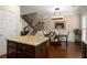 Eat-in kitchen with center island, granite countertops, and hardwood flooring, with open access to dining area at 2305 Limehurst Ne Dr # 21, Atlanta, GA 30319