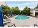 Community pool with multiple lounge chairs and umbrellas at 2305 Limehurst Ne Dr # 21, Atlanta, GA 30319