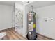 This clean bathroom features a tiled shower with black fixtures and a modern water heater at 5153 Westbrook Pl, Union City, GA 30291