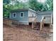 View of the rear exterior elevation with a wooden ramp and steps leading to a porch at 5153 Westbrook Pl, Union City, GA 30291