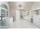Spacious bathroom with a modern soaking tub, glass enclosed shower, and beautiful marble flooring at 5755 Riley Rd, Cumming, GA 30028