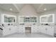 Bathroom with double vanity, marble counters, and large illuminated mirrors offering plenty of space at 5755 Riley Rd, Cumming, GA 30028
