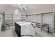Spacious walk-in closet with custom shelving, a center island, and an elegant light fixture at 5755 Riley Rd, Cumming, GA 30028