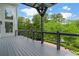 Relaxing deck with scenic views and overhead covering for sun protection at 5755 Riley Rd, Cumming, GA 30028