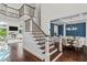 Beautiful foyer with a staircase that leads into a formal dining area at 5755 Riley Rd, Cumming, GA 30028