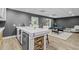 This open concept game room has a bar and pool table. Perfect for entertaining at 5755 Riley Rd, Cumming, GA 30028