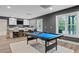 A game room featuring a billiards table and an outdoor walkout to a pool at 5755 Riley Rd, Cumming, GA 30028