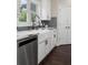 White farmhouse sink and subway tile in a well-lit kitchen at 5755 Riley Rd, Cumming, GA 30028