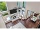Bright living room with fireplace, modern furniture, and view of outdoor pool at 5755 Riley Rd, Cumming, GA 30028