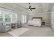 Spacious main bedroom with coffered ceiling and seating area at 5755 Riley Rd, Cumming, GA 30028