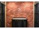 Unique wine room featuring a brick wall with vintage wine racks at 5755 Riley Rd, Cumming, GA 30028