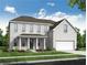 Charming two-story white brick home with a covered front porch and a two-car garage at 6955 Melody Ridge Rd, Buford, GA 30518