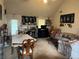 Cozy living room featuring a fireplace, carpeted floors, and large windows providing ample natural light at 7513 Sugarcreek Dr, Riverdale, GA 30296