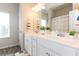 Bright bathroom featuring double vanity, framed mirror and decor at 137 Prominence Ct, Canton, GA 30114