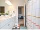 Bright bathroom featuring a double vanity, framed mirror and colorful decor at 137 Prominence Ct, Canton, GA 30114