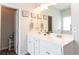 Bright bathroom with double sinks, lots of cabinet space, and tile backsplash at 137 Prominence Ct, Canton, GA 30114