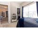 Bedroom with bookshelf, closet, and window at 137 Prominence Ct, Canton, GA 30114