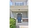 Inviting front entrance featuring a blue front door, stone accents, and a cozy covered porch at 137 Prominence Ct, Canton, GA 30114
