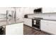 Close-up view of a kitchen boasting granite counters, stainless steel appliances, and white subway tile backsplash at 137 Prominence Ct, Canton, GA 30114