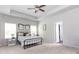 Spacious main bedroom featuring tray ceilings and lots of natural light at 137 Prominence Ct, Canton, GA 30114