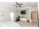 Main bedroom with modern ceiling fan, ensuite bathroom, and large dresser at 137 Prominence Ct, Canton, GA 30114