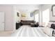 View from main bedroom to the living area featuring a gray sofa at 137 Prominence Ct, Canton, GA 30114