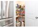 Walk-in pantry with wire shelving and a variety of organized food items and supplies at 137 Prominence Ct, Canton, GA 30114