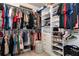 Spacious walk-in closet featuring custom shelving for ample storage and organization at 137 Prominence Ct, Canton, GA 30114