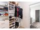 Large walk-in closet featuring custom shelving and storage solutions at 137 Prominence Ct, Canton, GA 30114