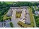 Overhead view of modern townhomes with a well-manicured central green space and convenient parking at 2005 Hamilton Creek Pkwy, Dacula, GA 30019