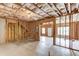 Unfinished basement space showing exposed wooden framing, windows, and potential for future living area at 2005 Hamilton Creek Pkwy, Dacula, GA 30019