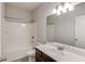 Bathroom with combination tub and shower, tile floor, and single vanity at 2005 Hamilton Creek Pkwy, Dacula, GA 30019