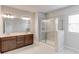 Modern bathroom featuring double vanity and a glass-enclosed tiled shower at 2005 Hamilton Creek Pkwy, Dacula, GA 30019