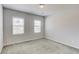 Bedroom with two windows and neutral carpet at 2005 Hamilton Creek Pkwy, Dacula, GA 30019