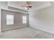 Spacious bedroom with carpet, ceiling fan and plenty of natural light from two windows at 2005 Hamilton Creek Pkwy, Dacula, GA 30019
