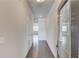 Entry hallway with hardwood floors and white walls, offering a glimpse into the bright living spaces at 2005 Hamilton Creek Pkwy, Dacula, GA 30019
