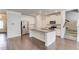 Bright, open kitchen with granite countertops, stainless steel appliances, and a spacious center island at 2005 Hamilton Creek Pkwy, Dacula, GA 30019