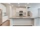 Modern kitchen with granite countertops, stainless steel appliances, and stylish white cabinetry at 2005 Hamilton Creek Pkwy, Dacula, GA 30019