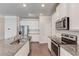 Well-appointed kitchen with granite countertops, stainless steel appliances, and bright white cabinetry at 2005 Hamilton Creek Pkwy, Dacula, GA 30019