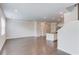 Open layout showcasing living room and kitchen area with hardwood floors and bright lighting at 2005 Hamilton Creek Pkwy, Dacula, GA 30019