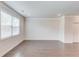 Spacious living room with a large window and white trim offers a clean and modern aesthetic at 2005 Hamilton Creek Pkwy, Dacula, GA 30019
