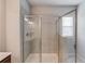 Bathroom with glass door shower featuring tiled walls at 2005 Hamilton Creek Pkwy, Dacula, GA 30019