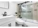 This bathroom features a shower-over-tub with a glass enclosure and modern fixtures at 3675 Peachtree Ne Rd # 24, Atlanta, GA 30319