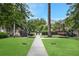 Serene condo community with lush green lawns and a peaceful walkway at 3675 Peachtree Ne Rd # 24, Atlanta, GA 30319