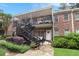 Charming two-story condo with brick exterior, balcony, and well-manicured landscaping at 3675 Peachtree Ne Rd # 24, Atlanta, GA 30319