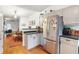 Updated kitchen with stainless steel appliances, sleek countertops, and a view into the dining area at 3675 Peachtree Ne Rd # 24, Atlanta, GA 30319