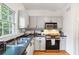 This kitchen features stainless steel appliances, ample counter space, and hardwood floors at 3675 Peachtree Ne Rd # 24, Atlanta, GA 30319
