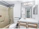 Functional bathroom features a shower-tub combo, a vanity with a sink and storage space at 1308 Camelot Dr, Atlanta, GA 30349