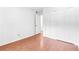 This is a cozy bedroom with wood floors and a spacious closet for optimal storage at 1308 Camelot Dr, Atlanta, GA 30349
